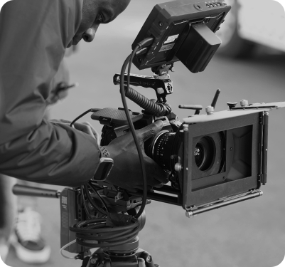 Image of cameraman filming a project